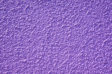 Rough purple concrete wall background, texture