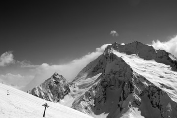 Black and white view on ski slope and snow mountain in winter