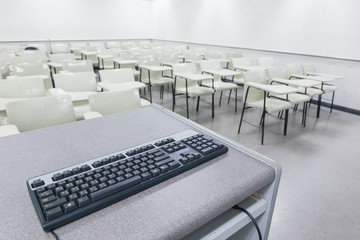Computer keyboard in table in classroom