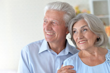 Happy elderly couple embracing