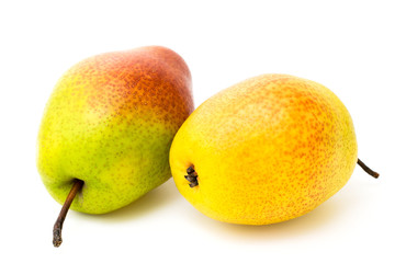 Two ripe pears on a white