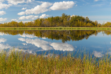 The lake with clouds .