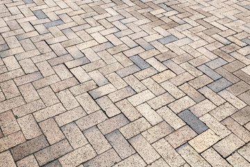 Yellow gray cobblestone road pavement