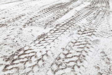 Tractor tire tracks pattern on sandy ground