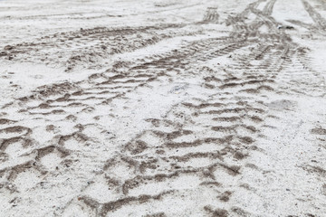 Tractor tire tracks pattern on sandy ground