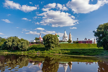 Fototapeta na wymiar Church buildings in a Sunny cloudy day on the banks of the Moscow river City Kolomna Moscow region