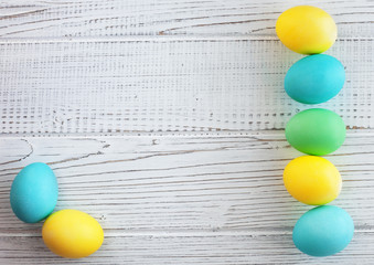 Colored eggs on a white background. The concept of Easter and spring.