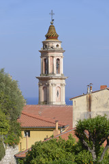 Fototapeta na wymiar Tower bell of baroque Basilica of Saint Michel Archange at Menton, a commune in the Alpes-Maritimes department in the Provence-Alpes-Côte d'Azur region in southeastern France.