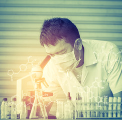 Chemist is analyzing sample in laboratory