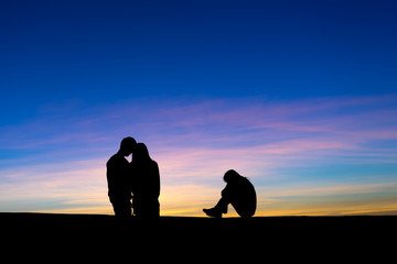 Silhouette of Complicated love relationship between three people.  One man and two women - love...