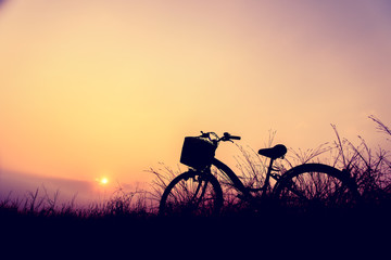 Fototapeta na wymiar beautiful landscape image with Silhouette Bicycle at sunset
