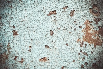 Abstract corroded colorful rusty metal background. Blue paint flaking and cracking texture on rusty metal.