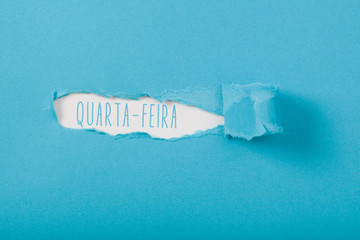 Quarta-Feira (Portuguese Wednesday) weekday message on Paper torn ripped opening
