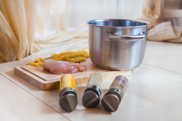 Ingredients cooking chicken fillet pasta wooden background top view