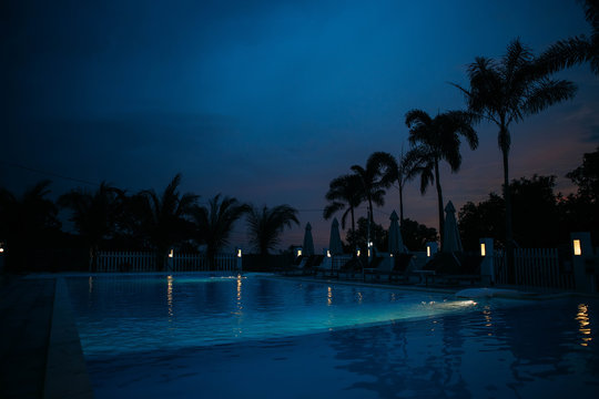 Swimming pool in night illumination tropical island