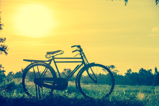 beautiful landscape image with Bicycle in vintage tone style