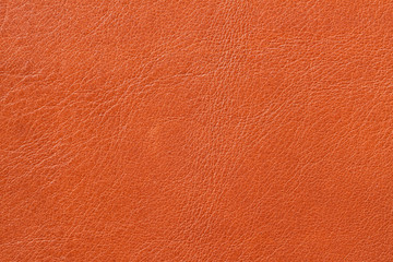 Texture of genuine leather close-up, cowhide, orange. For natural, artisan backgrounds, backdrop,...