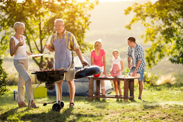 Happy generation family having a barbecue party.