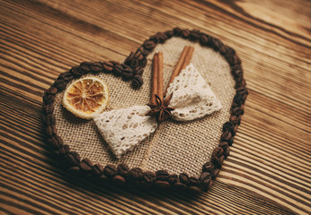 decorated heart on a wooden background