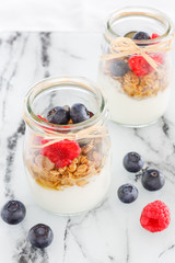  Granola with yogurt and berries. Yogurt with blueberries and raspberries 
