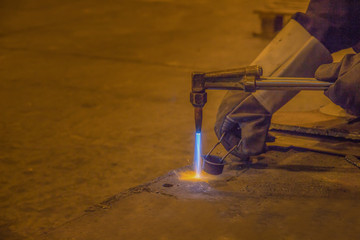 A man skilled working factory welder,cutting,grinding,drill