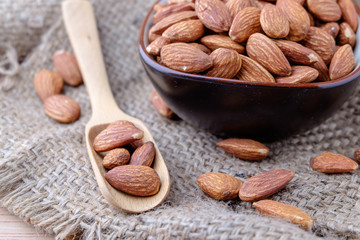 Almonds on sackcloth background