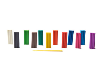 Set of modeling clay pieces isolated on white background.