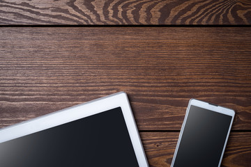 Modern digital devices on wooden table