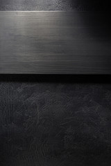 wooden signboard at black