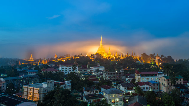 Shwedagon Paya pagoda in Gold Mist in the morning before sunrise .Myanmar famous sacred place and tourist attraction landmark.Yangon,