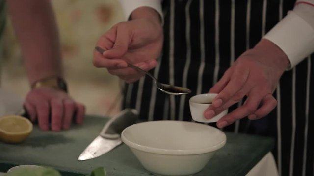 Cook cooking on a kitchen salad