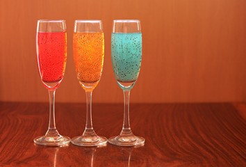 Glass healthy drink mix basil seeds brown backdrop.