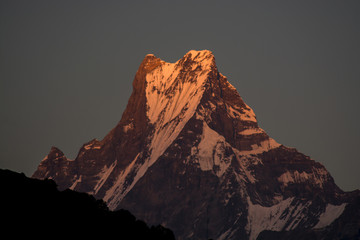 Mountain peak with orange shade of evening light