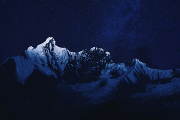 Mountain range in the night with stardust background