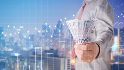 Businessman with money in hand, US dollar (USD) bills - investment, success and profitable business...