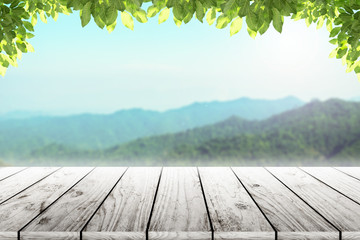 Wood table top on mountain natural background. concept party,display, county, products,natural,farm,organic.