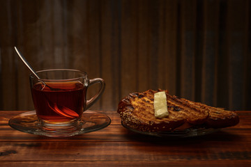 Tea and toast on a wooden background