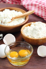 Ingredients for baking: cottage cheese, eggs and flour