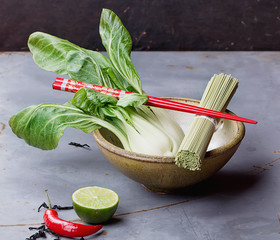 Ingredients for Japanese noodle soup. Green tea noodles, bok choi cabbage, enoki and shimeji...