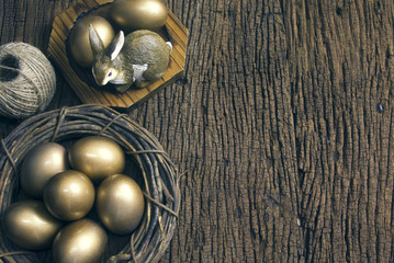 easter gold eggs and wood