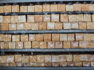 bread in plastic bag on shelf