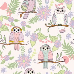 Obraz premium Vector seamless pattern with owls and flowers