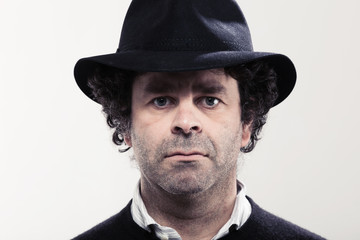 Closeup of a man with a black hat