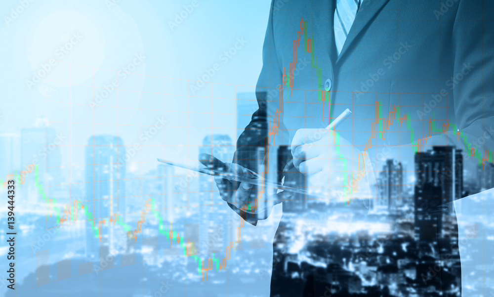 Poster double exposure of business man working with a digital tablet with cityscape blurred building backgr
