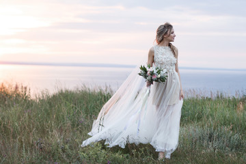 Fototapeta na wymiar pretty bride in a field of rye