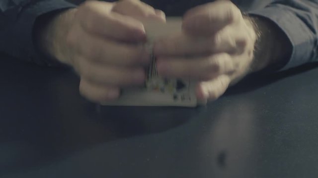 Man's hands shuffing cards. Pocker game
