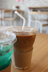 Iced Coffee with Turquoise Soda Drink in a Cafe