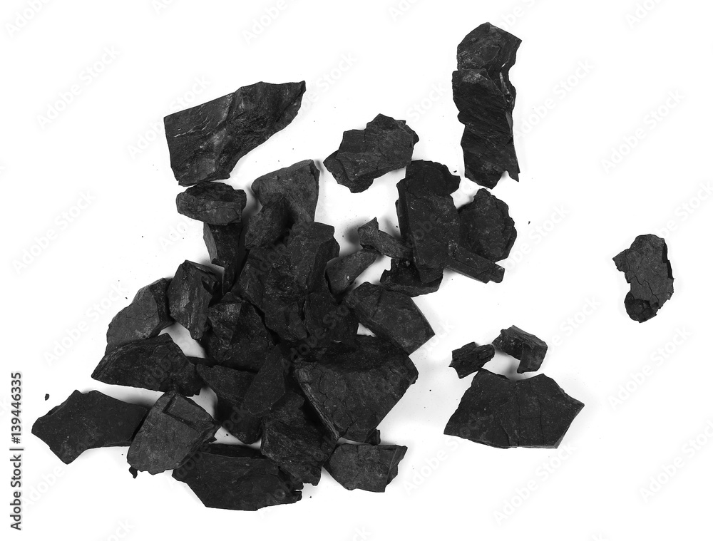 Wall mural pile black coal isolated on white background