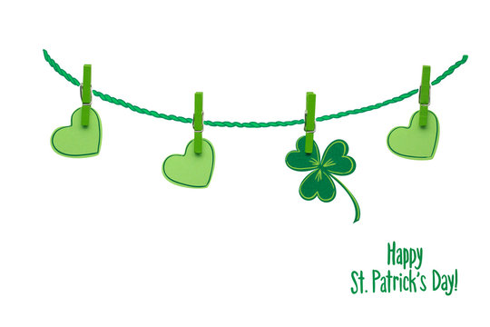 Good luck / Creative St. Patricks Day concept photo of pinned  shamrocks and hearts made of paper on white background. - Powered by Adobe