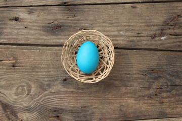 Easter egg on old wooden background with copy space 